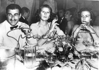 Bellentani Murder. The famous shot taken a few minutes before the woman on the left killed her lover during a party. Villa d'Este (Como), 1948