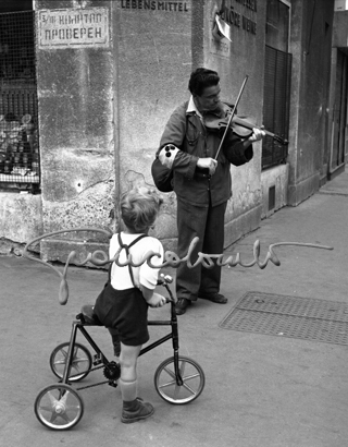 A beggar plays violin, Vienna, 1951