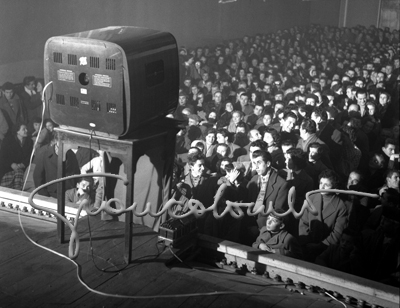 Broadcasting a popular TV show inside a theatre, Carpi, 1956